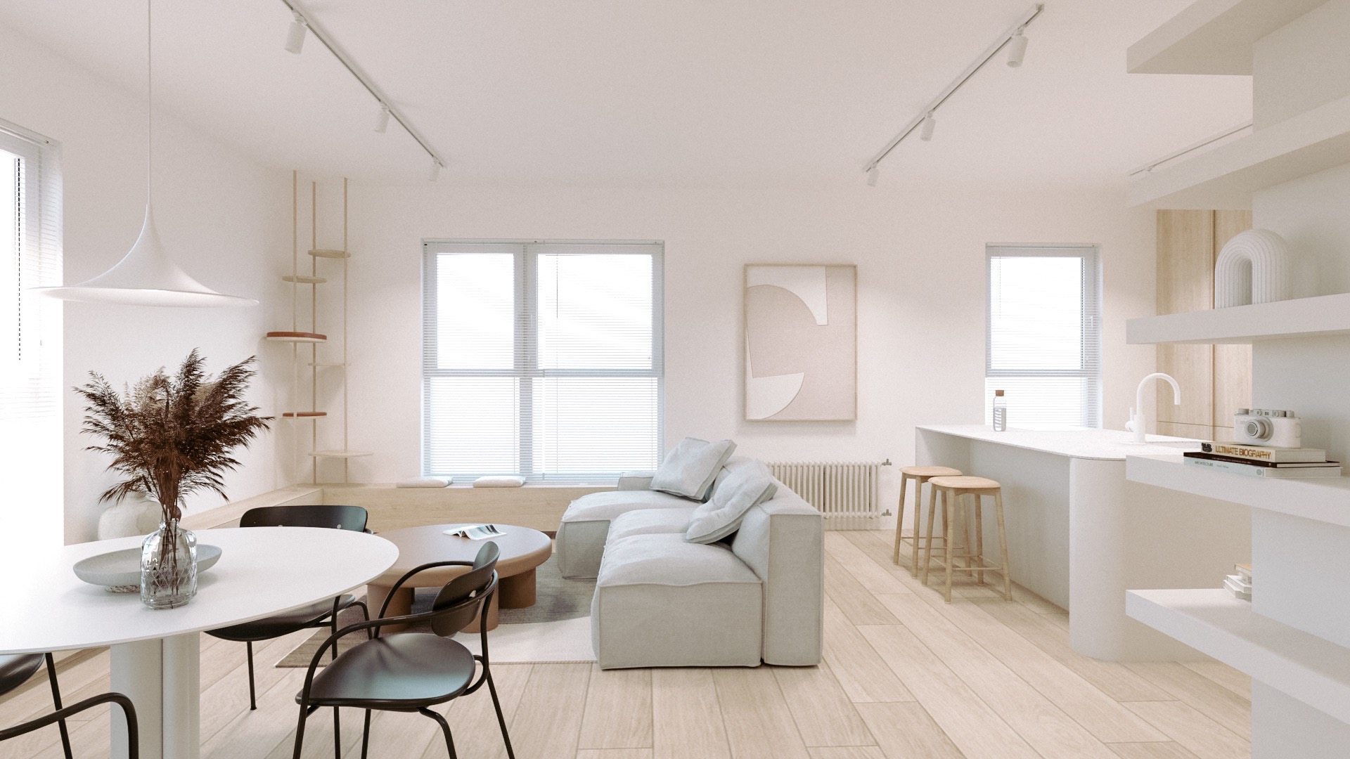 Jasne, minimalistyczne wnętrze mieszkania z drewnianą podłogą, białymi ścianami, narożną sofą, okrągłym stołem jadalnym z bukietem suszonych kwiatów oraz aneksem kuchennym z hokerami i półkami.