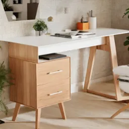 Nowoczesne biurko z białym blatem i drewnianymi nogami oraz szafką z dwiema szufladami, uzupełnione o rośliny doniczkowe i akcesoria biurowe, na tle ściany z mozaiką.