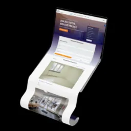 Prezentacja strony internetowej agencji nieruchomości z Bielska-Białej na zakrzywionym ekranie laptopa, widoczne formularze wyszukiwania i oferty nieruchomości.