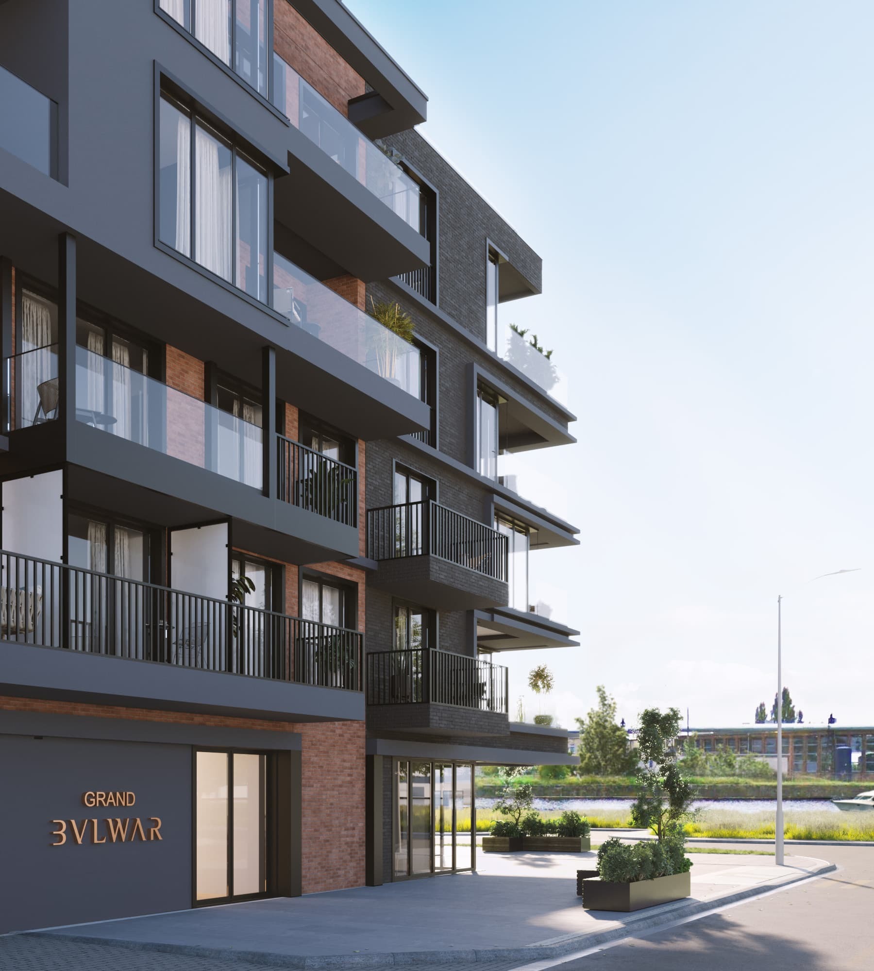 Nowoczesny budynek apartamentowy Grand Bvlwar z balkonami, elewacją z szarej cegły i przeszkleniami, widok z poziomu ulicy na wejście.