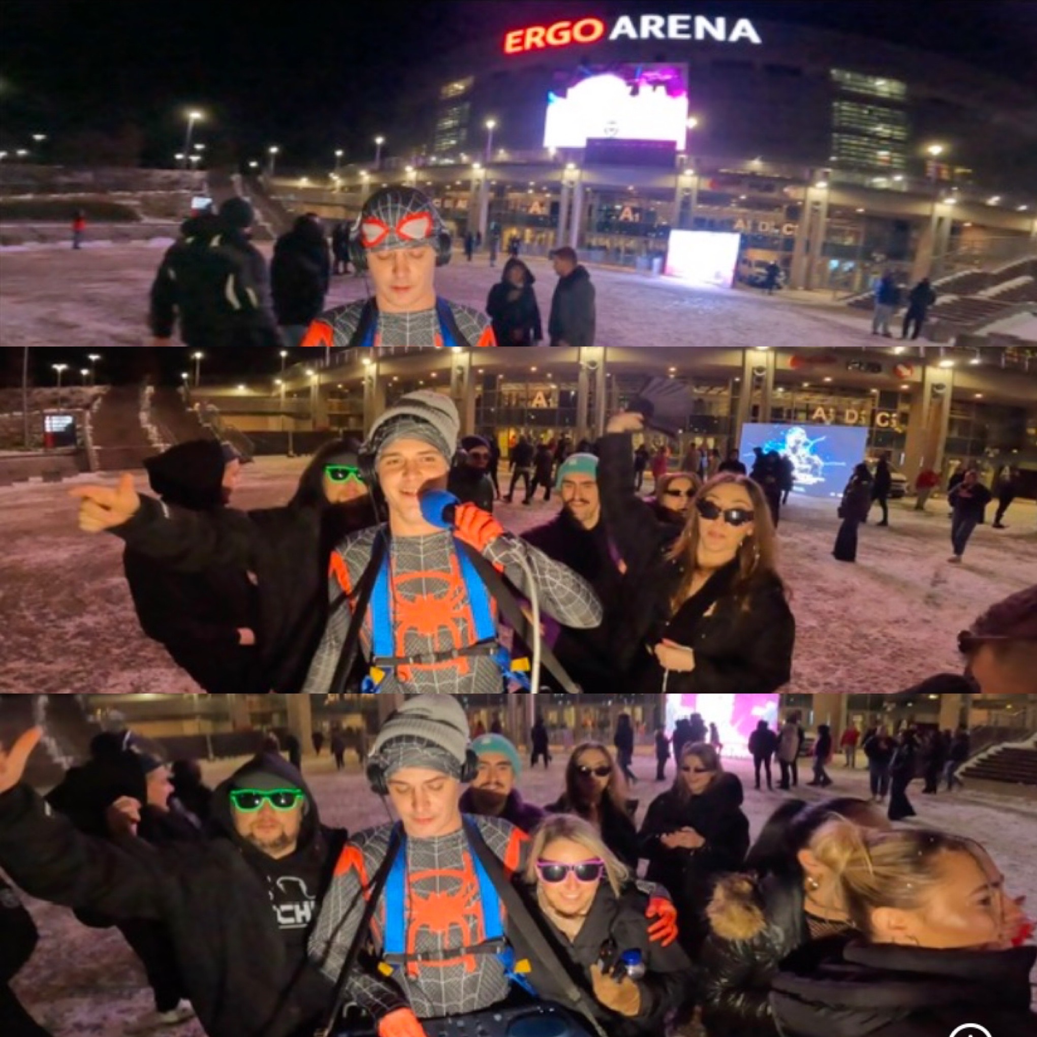 Animator w stroju Spider-Mana z mikrofonem i DJ-ką, otoczony przez publiczność przed Ergo Areną, w zimowej scenerii. Nocne oświetlenie, dynamiczne ujęcie.