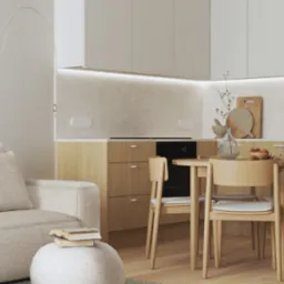 Jasna kuchnia z drewnianymi szafkami, okrągłym stołem i krzesłami w stylu skandynawskim, widok z salonu z beżową sofą i lampą łukową