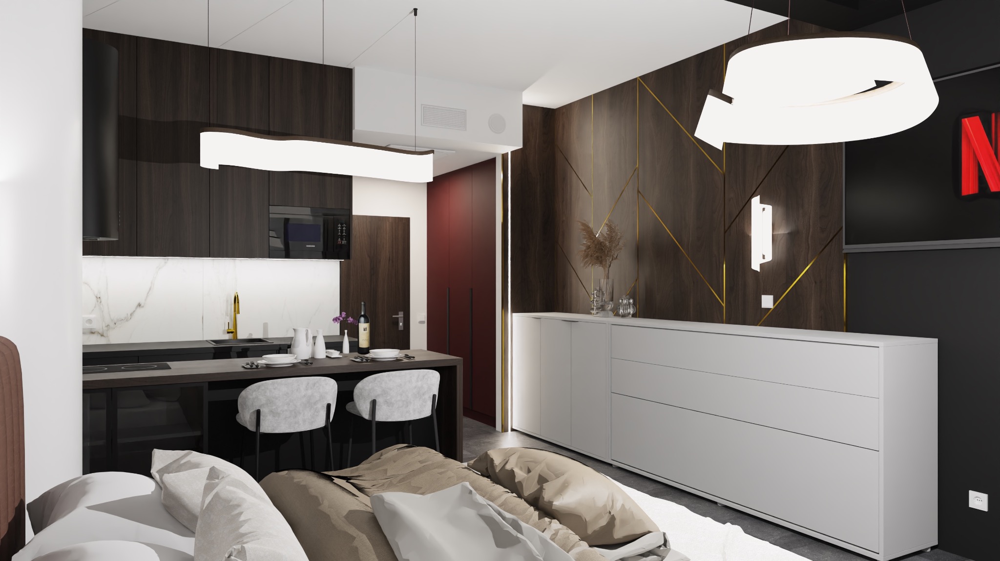 Nowoczesne studio z otwartą kuchnią, ciemnymi drewnianymi szafkami, białym marmurowym blatem, wyspą z szarymi krzesłami, oraz szafką RTV z dekoracyjną ścianą i poduszkami na pierwszym planie.