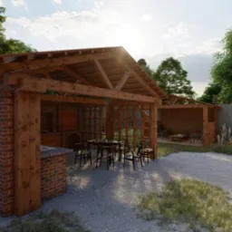 Zadaszona letnia kuchnia z ceglanym grillem, drewnianą konstrukcją i stołem z krzesłami na żwirowym podłożu w ogrodzie.