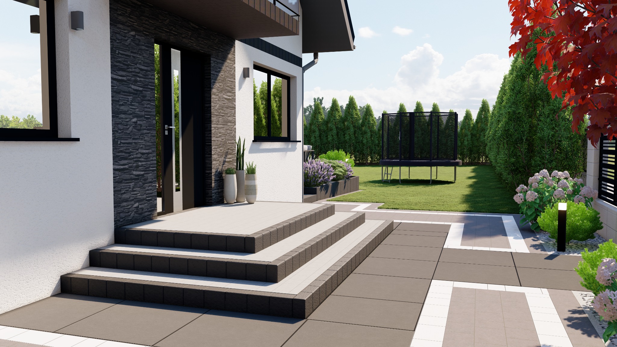 Nowoczesny dom z elewacją z kamienia dekoracyjnego, schodami wyłożonymi płytkami i tarasem z szarej kostki brukowej, w tle trawnik z trampoliną i roślinnością.