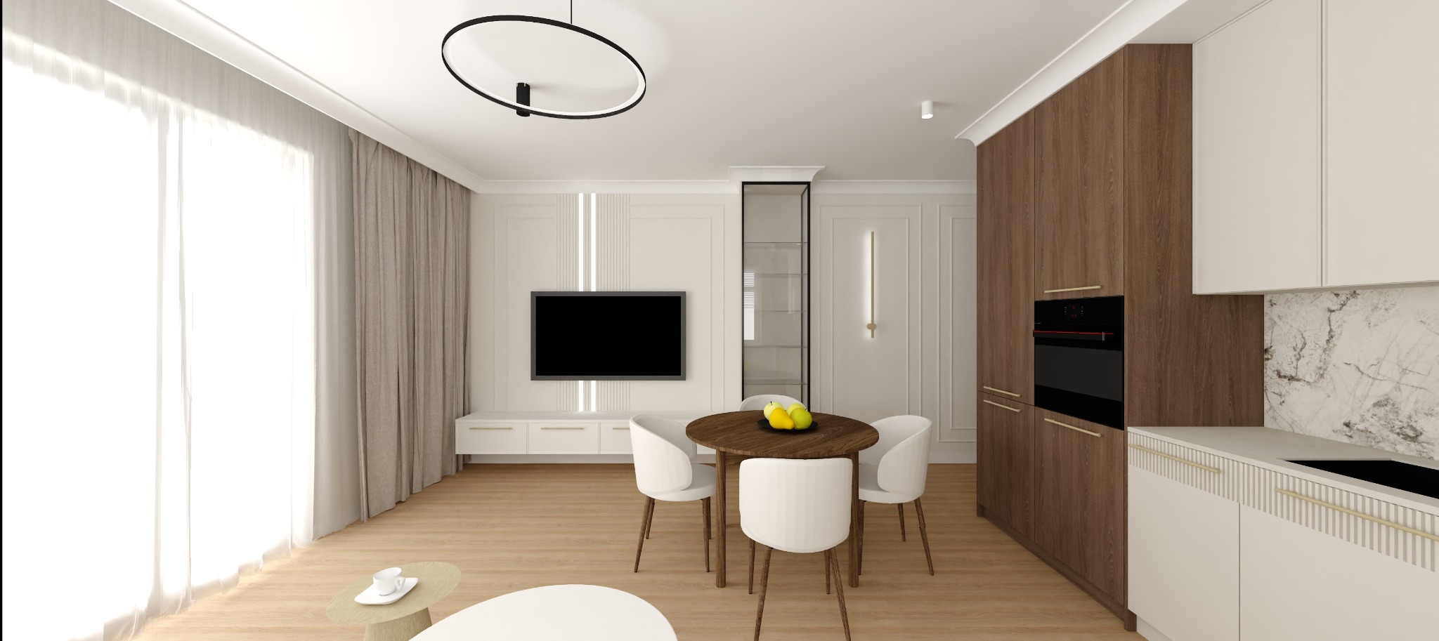 Wnętrze salonu z aneksem kuchennym: okrągły stół z owocami, białe krzesła, zabudowa kuchenna w drewnie i bieli, telewizor na ścianie z dekoracyjnymi panelami.