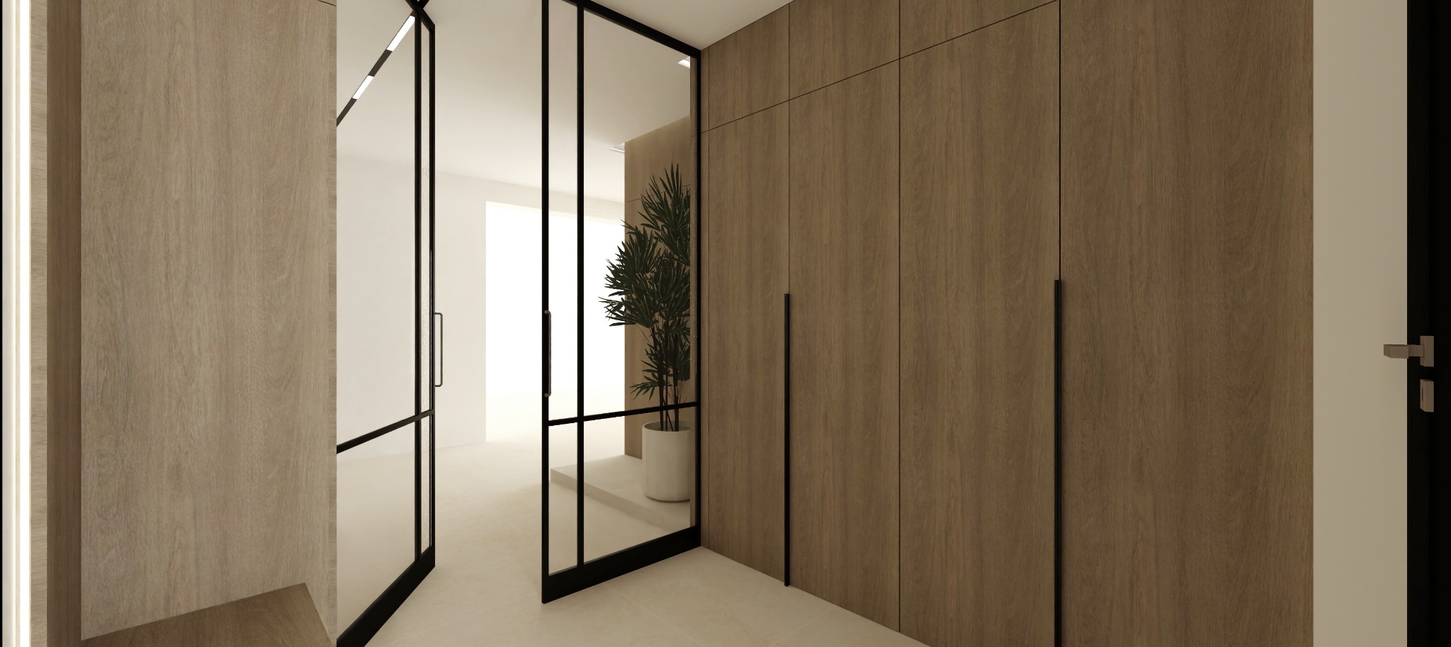 Nowoczesna szafa wnękowa z drewnianymi frontami i czarnymi uchwytami, widoczna przez szklane drzwi w czarnej ramie. Minimalistyczny design, jasne wnętrze.