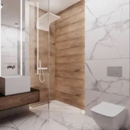 Nowoczesna łazienka z marmurową podłogą i ścianami, kabina prysznicowa ze szklaną ścianką i drewnopodobnymi płytkami, minimalistyczna umywalka na drewnianej szafce i podwieszana toaleta.