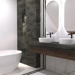 Nowoczesna łazienka z wolnostojącą wanną, dwoma owalnymi umywalkami na ciemnym blacie z drewnianą szafką, podwieszanymi lampami i lustrami w kształcie zaokrąglonych prostokątów, wykończona płytkami...