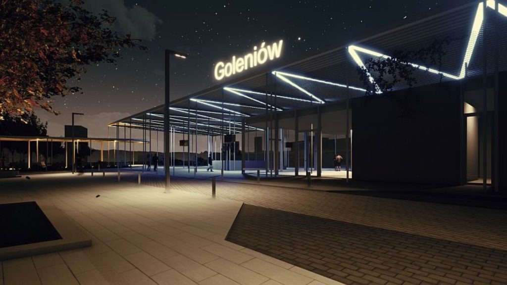 Nocna wizualizacja budynku w Goleniowie z neonowym napisem. Budynek oświetlony, z widocznymi osobami w oddali i gwiazdami na niebie.