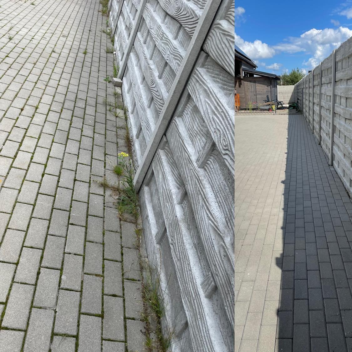 Szara kostka brukowa z zielonymi chwastami przy betonowym płocie z imitacją drewna; widok z perspektywy chodnika.