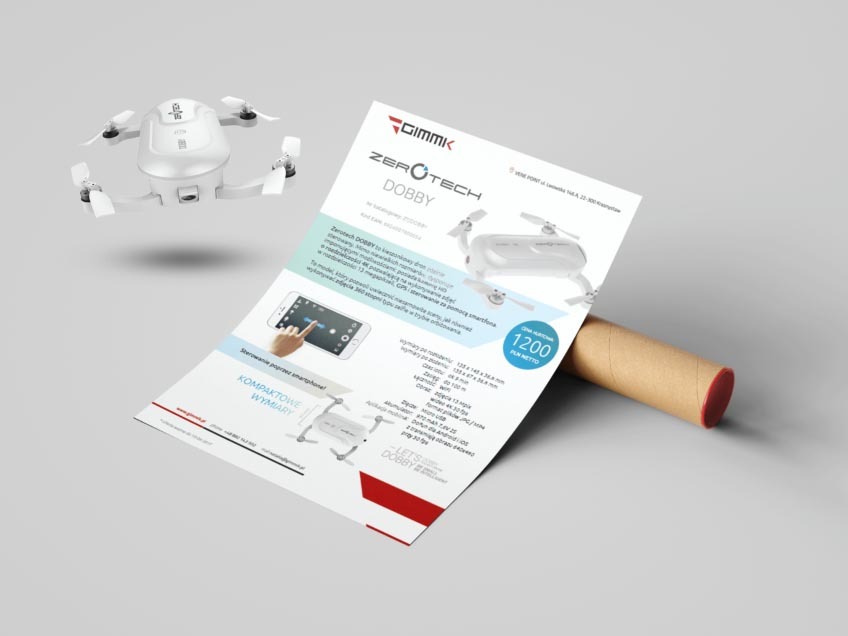 Biały dron na ulotce reklamowej z opisem parametrów i ceną, obok leży zwinięty plakat.