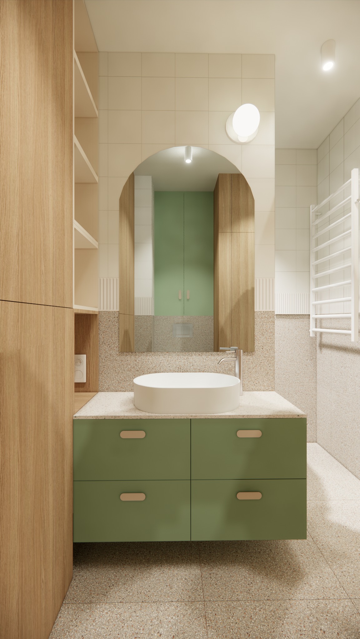 Nowoczesna łazienka z zieloną szafką pod umywalką, okrągłą białą umywalką nablatową i lustrem w łuku, oświetlona lampą sufitową, z widocznymi płytkami imitującymi lastryko na podłodze i ścianach.