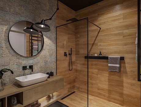Nowoczesna łazienka z kabiną prysznicową typu walk-in, umywalką nablatową, okrągłym lustrem z oświetleniem punktowym i płytkami imitującymi drewno oraz beton