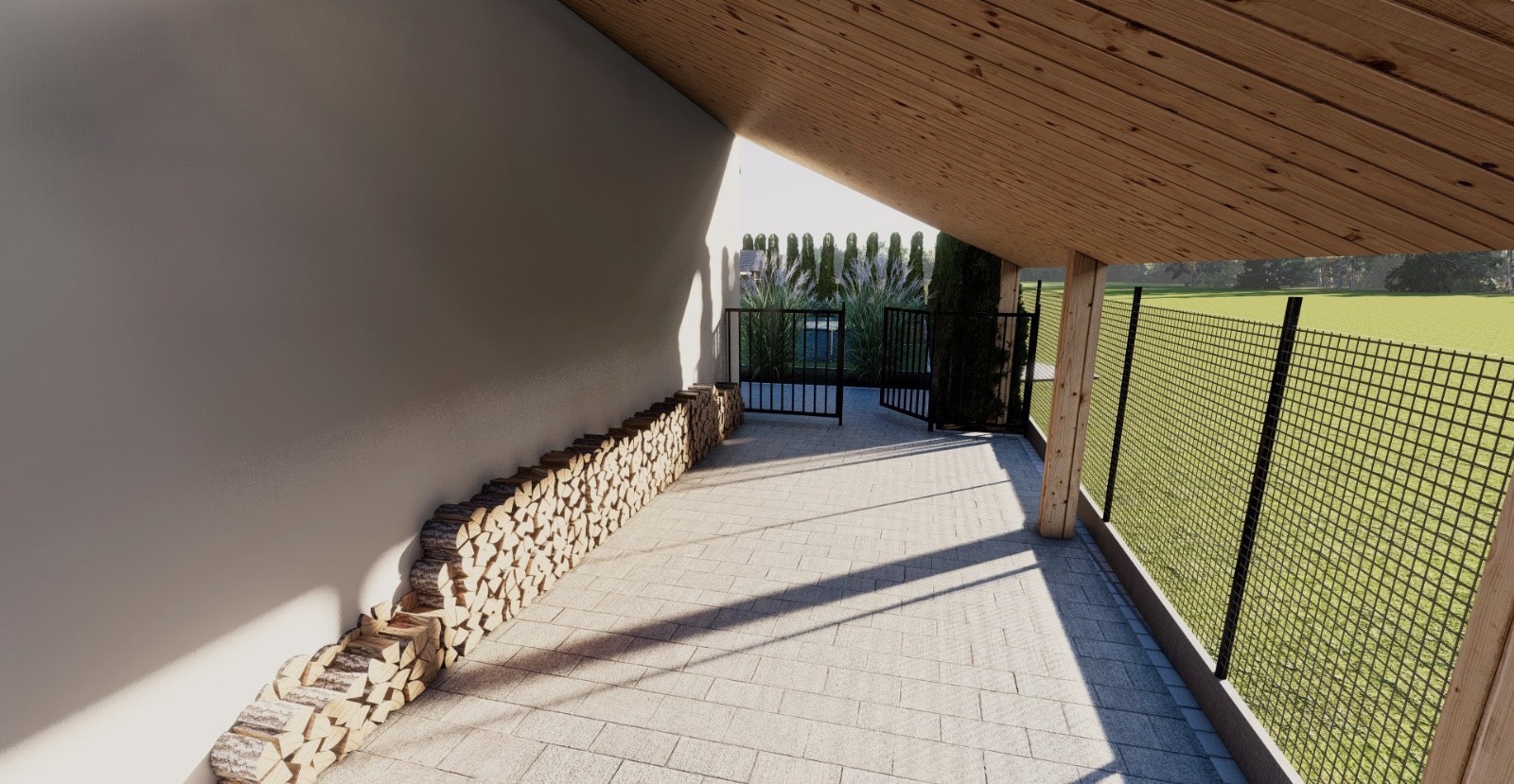 Zadaszone przejście z ułożonym drewnem opałowym wzdłuż ściany i widokiem na ogród z bramą i siatką ogrodzeniową.