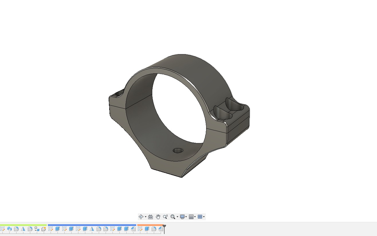 Model 3D obejmy z dwoma otworami montażowymi, renderowany w programie CAD z widocznym interfejsem użytkownika w dolnej części.