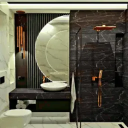 Elegancka łazienka z czarnymi marmurowymi płytkami, okrągłym lustrem, białą umywalką nablatową, złotymi akcentami armatury i dekoracyjnym obrazem na ścianie.