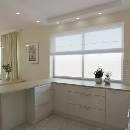 W naszej kuchni z szarym blatem i jasną podłogą, otwartej na salon, połączenie designu i praktyczności staje się harmonijnym tańcem, tworzącym inspirującą atmosferę. To nie tylko miejsce do gotowania, ale przede wszystkim przestrzeń do tworzenia wspomnień.