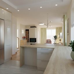 Witaj w kuchni, gdzie funkcjonalność spotyka się z elegancją. Nasza kuchnia z szarym blatem i jasną podłogą to prawdziwe arcydzieło designu, harmonijnie wkomponowane w otwartą przestrzeń salonu.