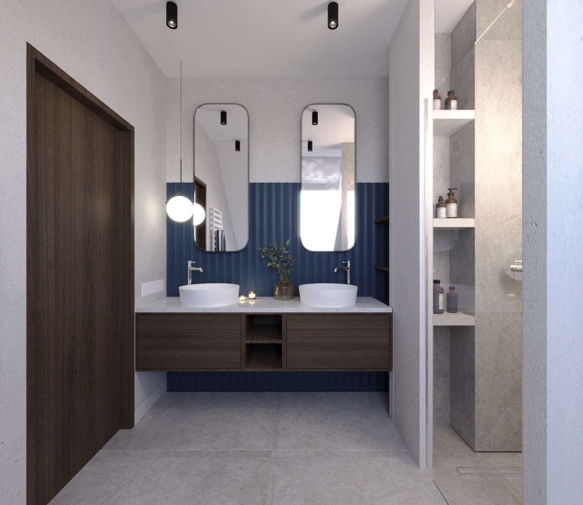 Nowoczesna łazienka z dwoma umywalkami nablatowymi, lustrami w zaokrąglonych ramach, niebieską ścianą z pionowymi żłobieniami i otwartym regałem na kosmetyki w strefie prysznica.