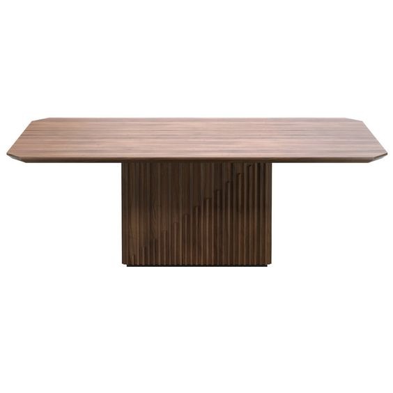 Prostokątny, drewniany blat stołu z zaokrąglonymi narożnikami, wsparty na rzeźbionej, drewnianej podstawie z pionowymi żłobieniami i ukośnym wzorem.