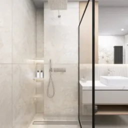 Beżowa łazienka z kabiną typu walk-in, umywalką na szafce z blatem imitującym marmur. W tle dekoracyjna tapeta i grzejnik.