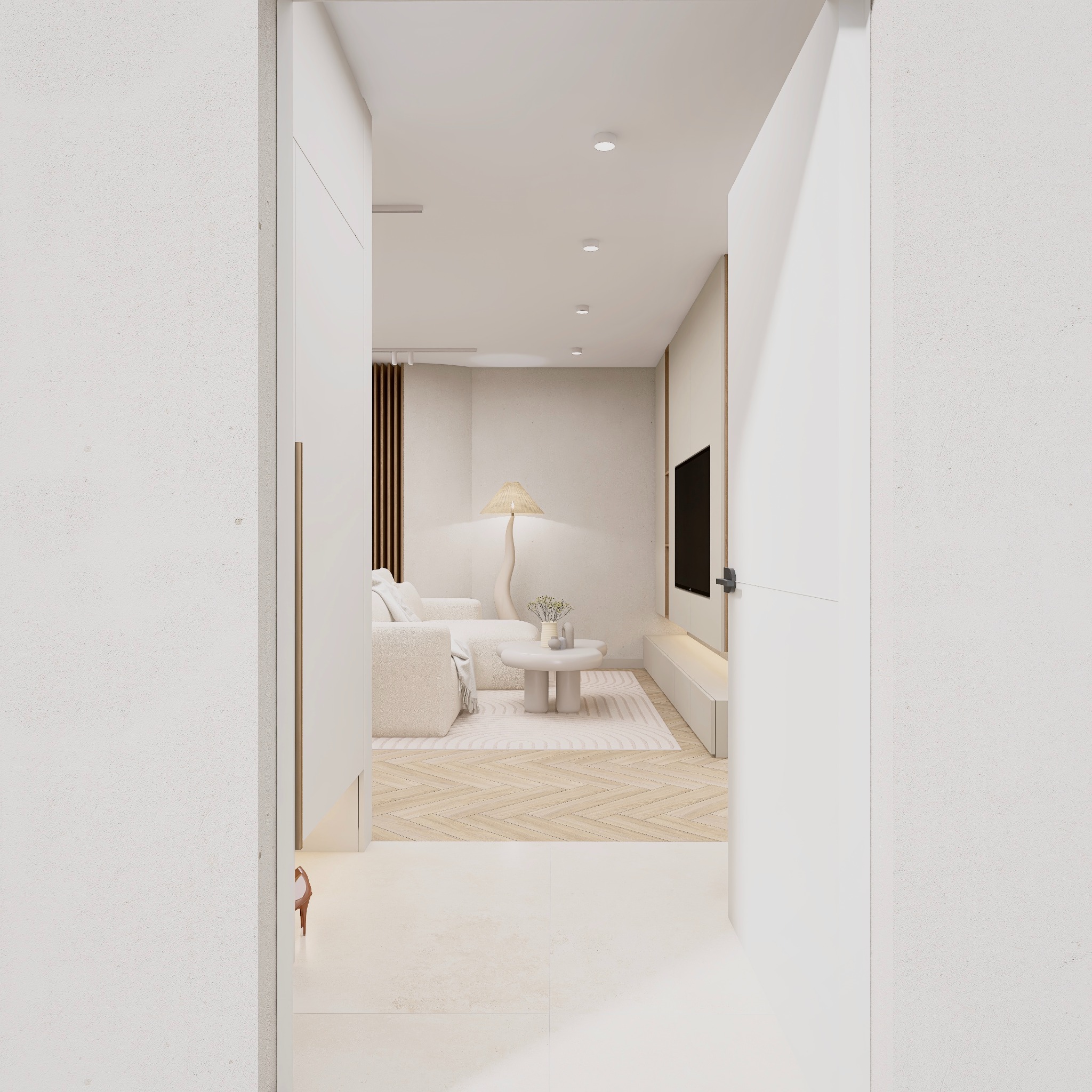 Jasne wnętrze salonu z beżową sofą i stolikiem kawowym, widoczne przez otwarte drzwi. Minimalistyczny design, drewniana podłoga w jodełkę, lampa podłogowa o organicznym kształcie.