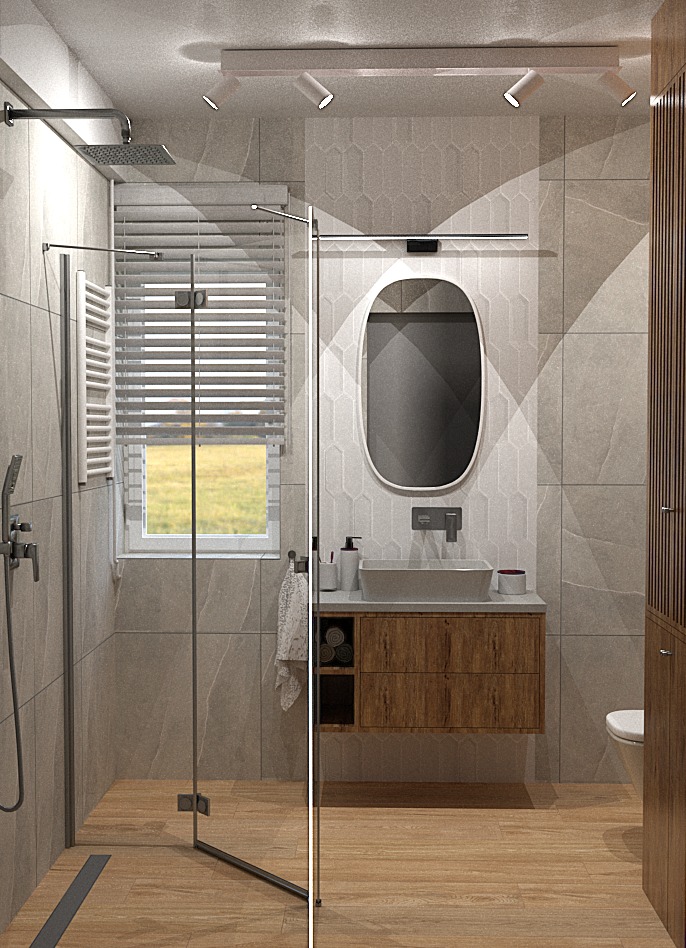 Nowoczesna łazienka z kabiną prysznicową typu walk-in, drewnianą szafką pod umywalką i owalnym lustrem na tle szarych płytek o geometrycznym wzorze.