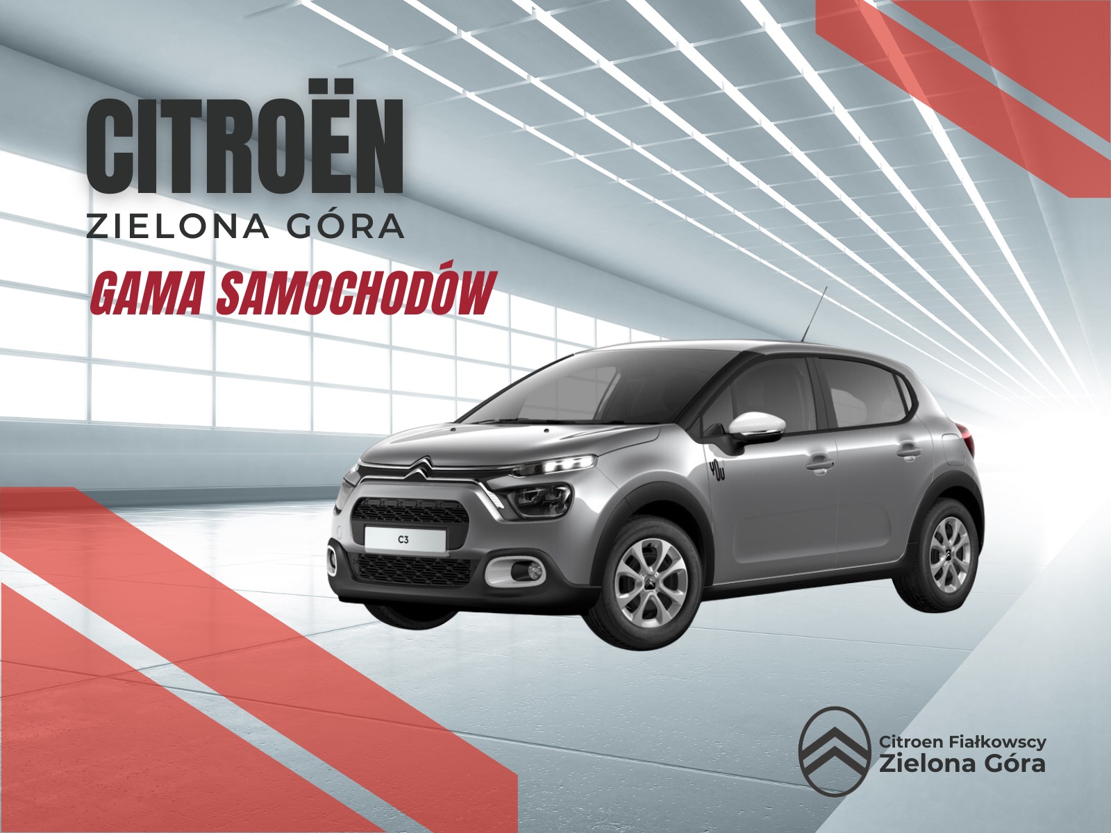 Srebrny Citroen C3 w salonie samochodowym Citroen Fiałkowscy Zielona Góra, z widocznym logo firmy i hasłem 'Gama Samochodów'.