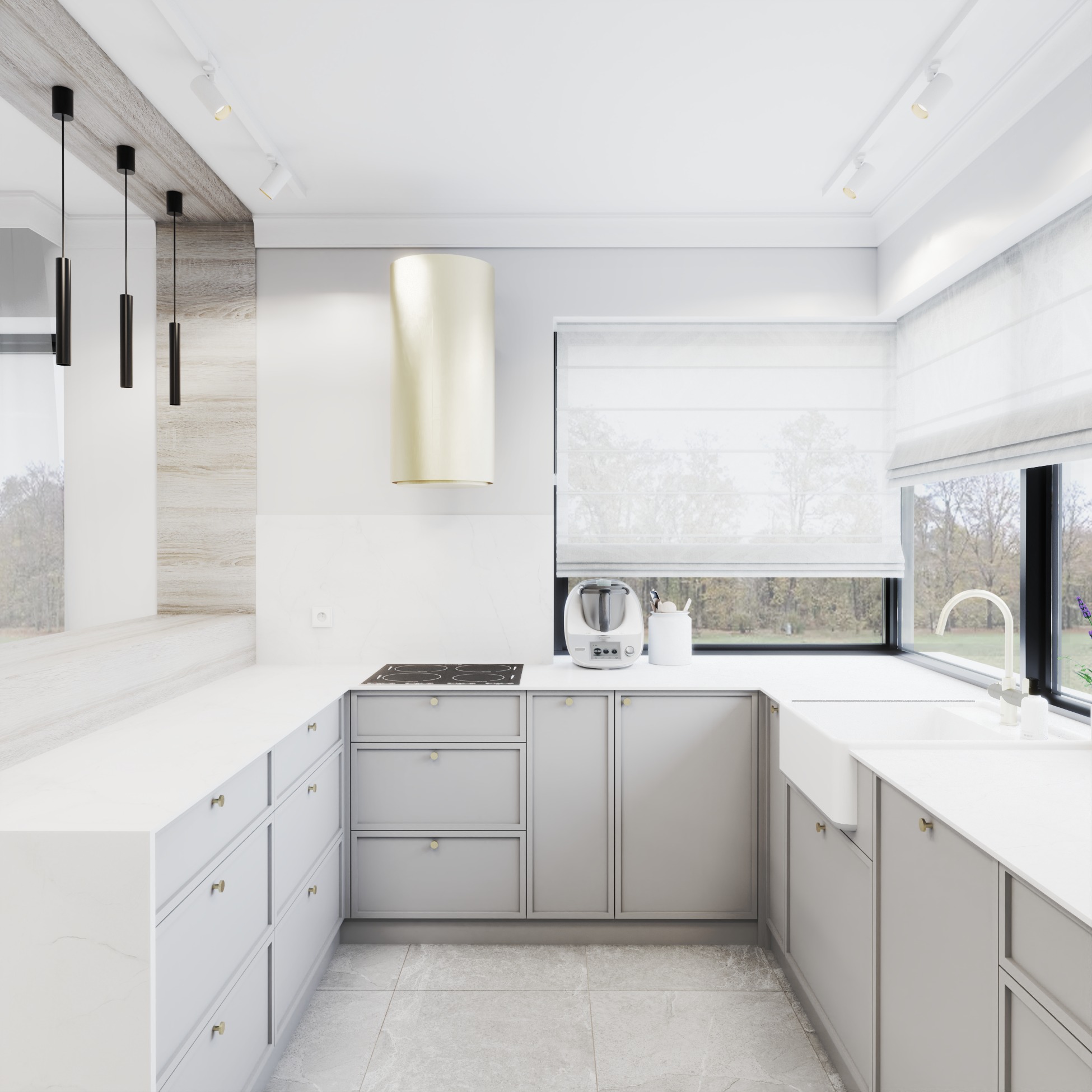 Jasna kuchnia w Granowie z szarymi szafkami i złotymi akcentami, okap w kolorze złota, minimalistyczne oświetlenie, okno z roletą rzymską i widokiem na zieleń.