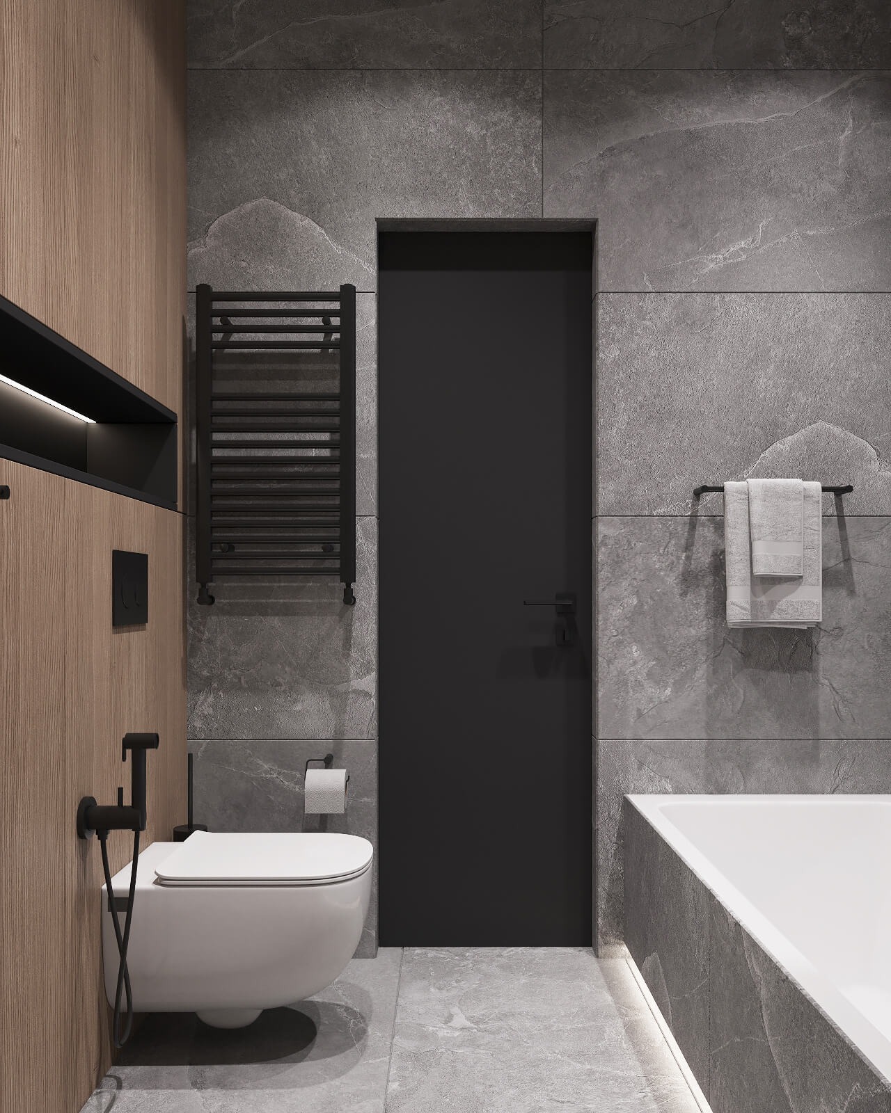 Nowoczesna łazienka z szarymi płytkami imitującymi kamień, drewnianą ścianą z zabudową, wiszącą toaletą z bidetką w kolorze czarnym, grzejnikiem drabinkowym i oświetleniem LED pod wanną.