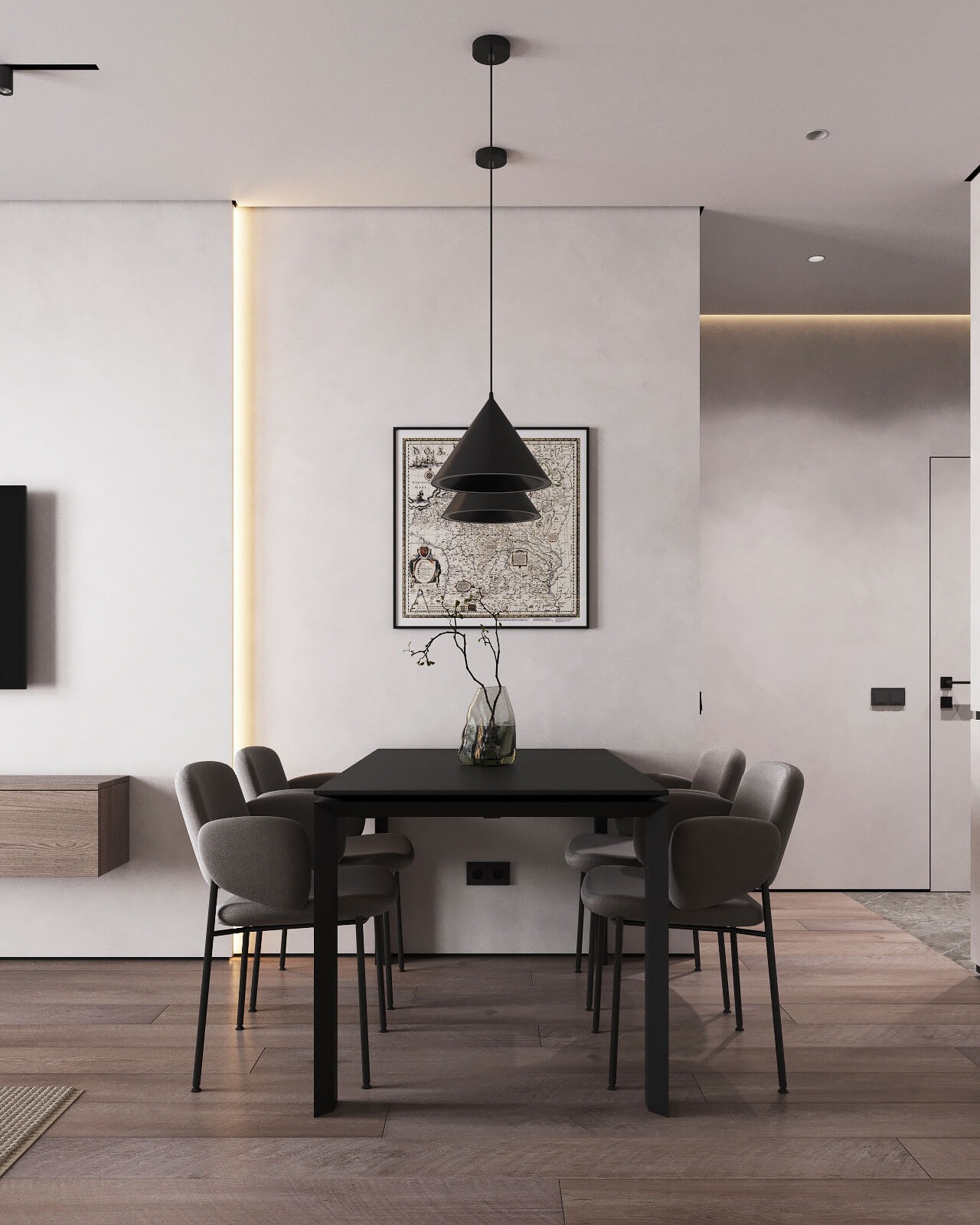 Minimalistyczna jadalnia z czarnym stołem, szarymi krzesłami i lampą w kształcie stożka. Na ścianie wisi mapa świata w czarnej ramie. Wazon z gałązkami na stole.