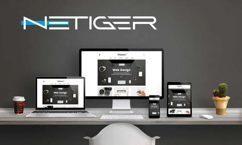 Prezentacja responsywnej strony internetowej na laptopie, monitorze, tablecie i telefonie, z logotypem firmy NETIGER w tle.