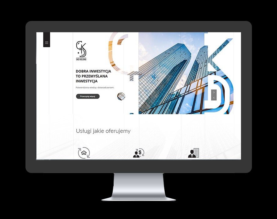 Monitor wyświetlający stronę internetową firmy SKD Holding z motywem inwestycyjnym, nowoczesny design z elementami graficznymi przedstawiającymi budynki i hasłem 'Dobra inwestycja to przemyślana...