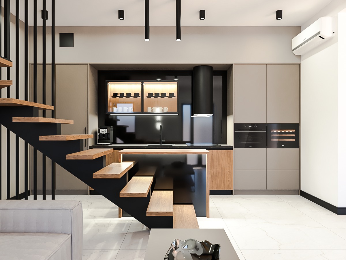 Nowoczesna kuchnia z wyspą i schodami z drewnianymi stopniami. Minimalistyczny design, czarne akcenty, oświetlenie punktowe i marmurowe podłogi.