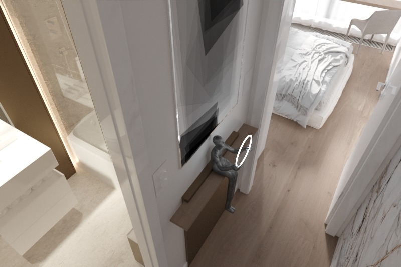 Wnętrze łazienki z widoczną wanną, umywalką i rzeźbą siedzącej postaci na półce pod abstrakcyjnym obrazem, z częściowym widokiem sypialni w tle.