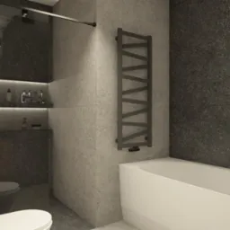 Minimalistyczna łazienka w odcieniach szarości z wanną, grzejnikiem drabinkowym i szklanym prysznicem z p&oacute;łkami na kosmetyki.