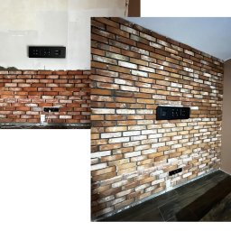 GENX SERVICES - Częściowo wykończona ściana z cegły klinkierowej z zamontowanym panelem elektrycznym; widoczna instalacja elektryczna w trakcie prac.