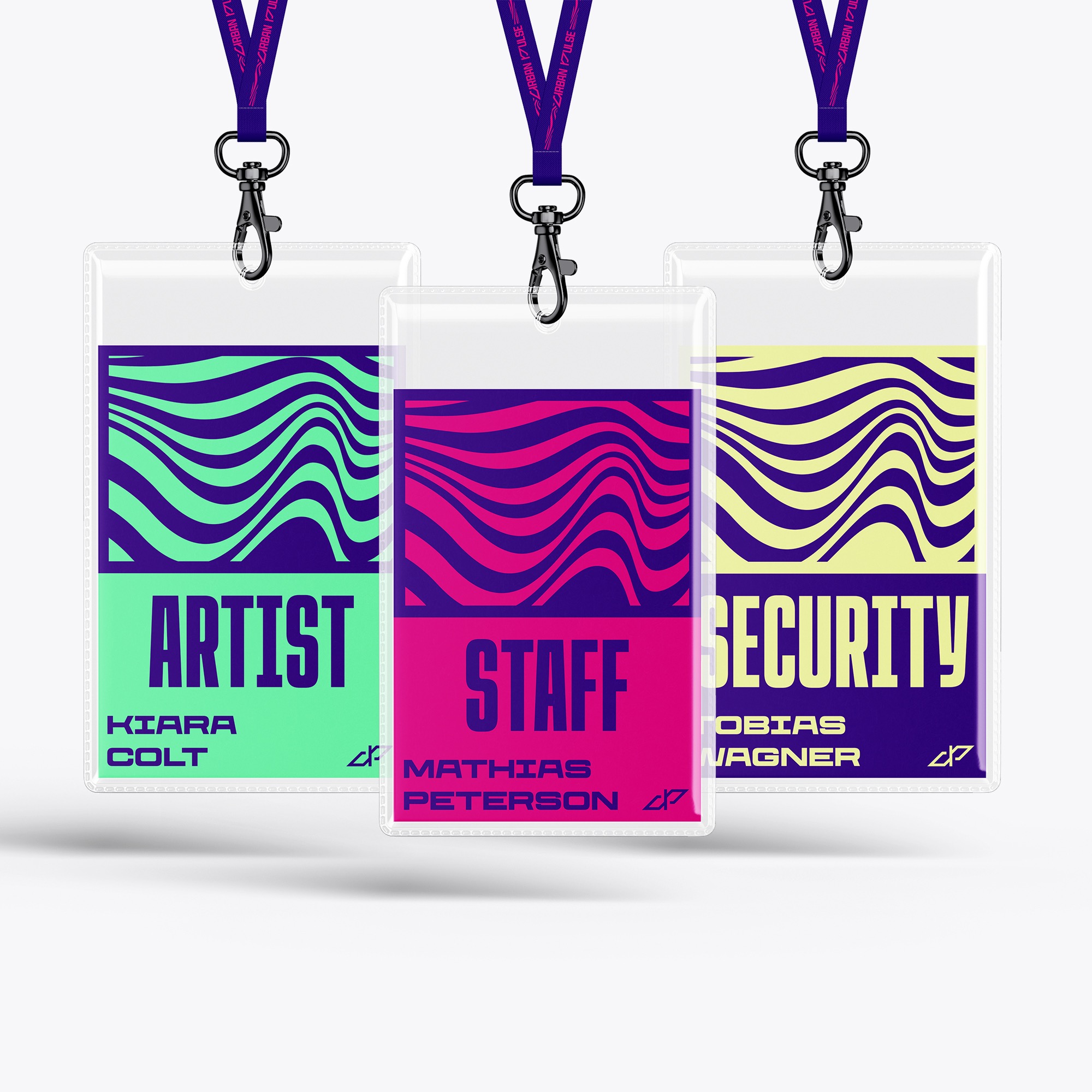 Trzy identyfikatory z napisami: 'Artist', 'Staff', 'Security', zawieszone na smyczach z logo 'Urban Pulse'. Każdy identyfikator ma unikalny wzór i kolorystykę.