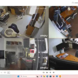 Podgląd z systemu monitoringu Imou, prezentujący cztery różne ujęcia z kamer: biuro z biurkiem, domowe wnętrze, przestrzeń z monitorami oraz stanowisko z mikserem audio, rejestrowane 19 marca 2024...