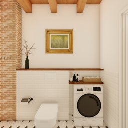 MG Interior Art Marta Godun - Wizualizacja łazienki z pralką, toaletą, ceglaną ścianą, drewnianymi belkami stropowymi i półkami z dekoracjami, utrzymana w jasnej kolorystyce z elementami rustykalnymi.