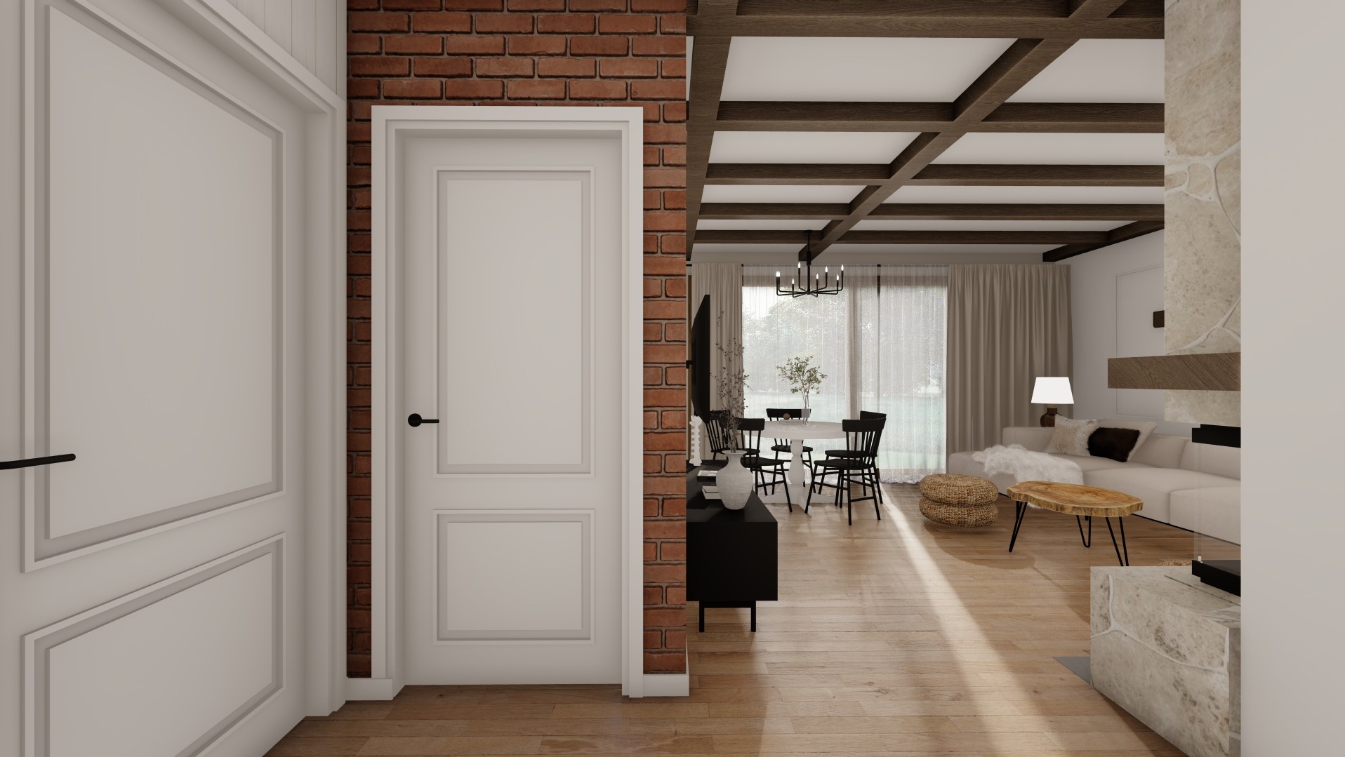 Wnętrze salonu z jadalnią, widok przez otwarte drzwi, ceglana ściana, drewniany sufit z belkami, biała sofa, okrągły stół z czarnymi krzesłami.