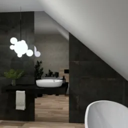 Wizualizacja łazienki na poddaszu z ciemnymi płytkami, białą armaturą, umywalką nablatową, rośliną w wazonie i nowoczesną lampą sufitową.