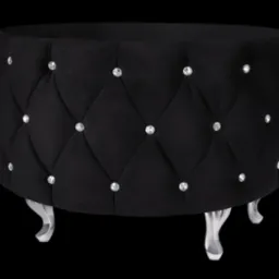 Czarny, okrągły puf tapicerowany welurem z pikowaniem w romby i dekoracyjnymi kryształkami, na czterech srebrnych, giętych nóżkach.