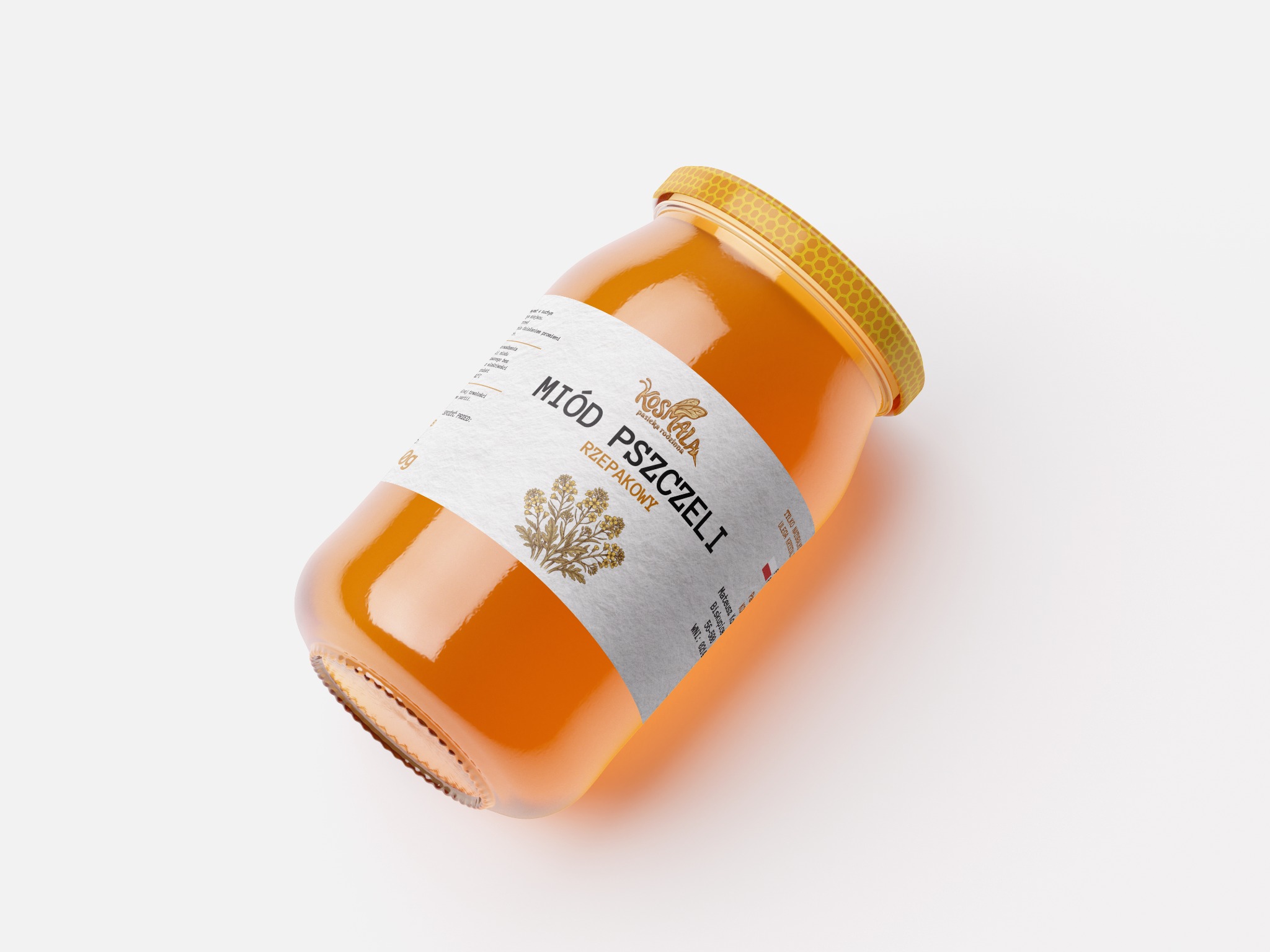 Słoik miodu rzepakowego z etykietą 'Pasieka Rodzinna Kosmala' na białym tle, ustawiony pod kątem, z widocznym złotym wieczkiem o strukturze plastra miodu.