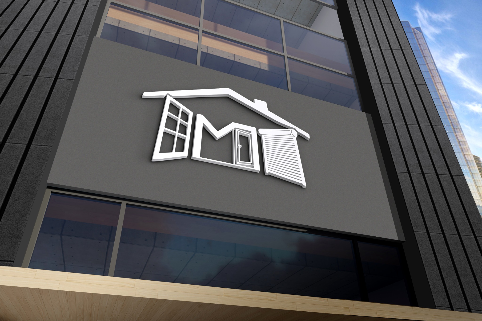 Białe logo w kształcie domu z oknami na szarym tle budynku. Widoczne elementy architektury i fragment nieba. Minimalistyczny design, nowoczesny budynek.