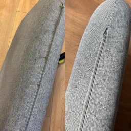 Volodymyr Rasskovskyi - Porównanie fragmentu szarej poduszki z zamkiem błyskawicznym przed i po czyszczeniu, widoczne różnice w czystości materiału.