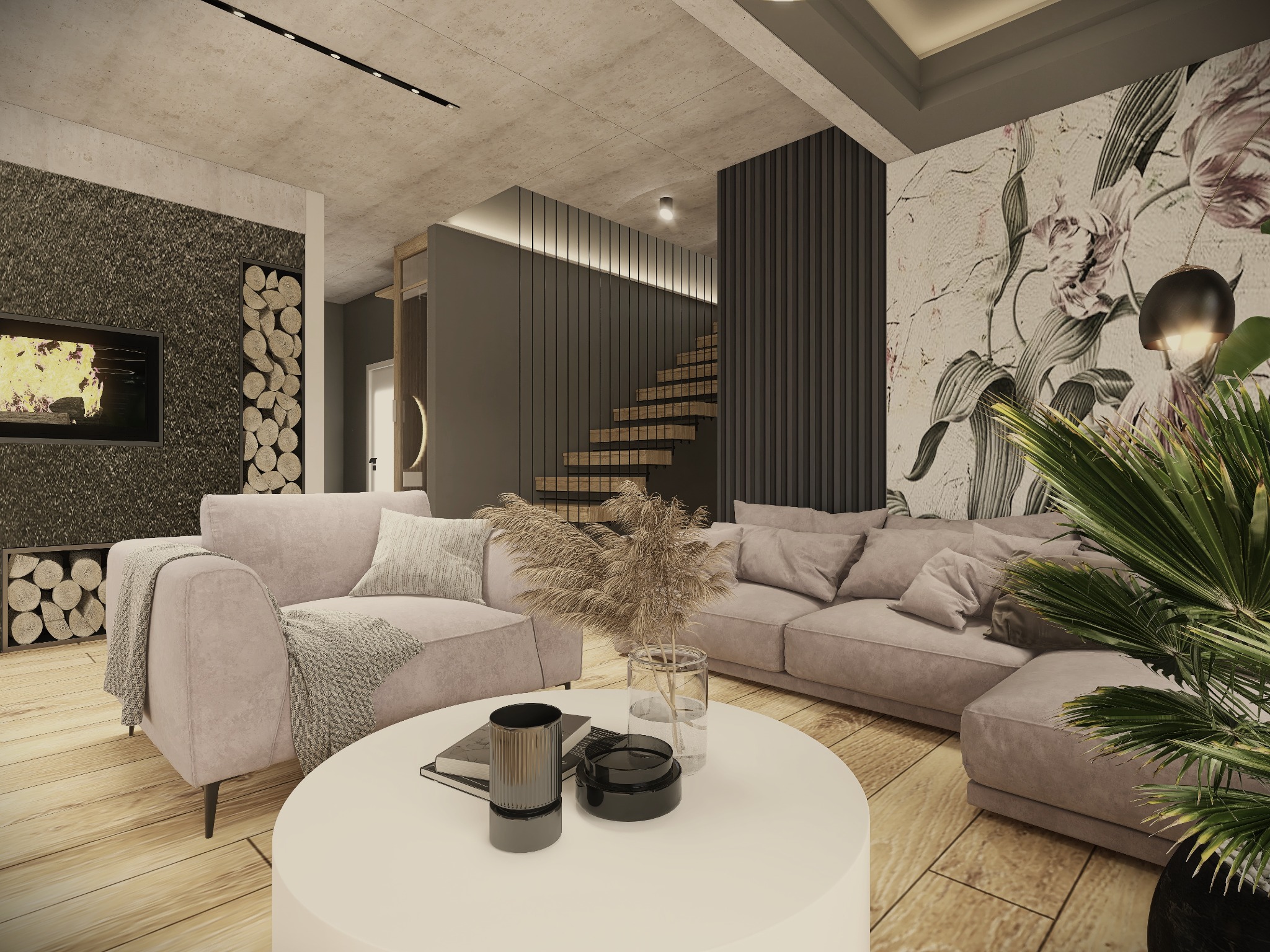 Jasny salon z kominkiem obłożonym kamieniem, drewnem ułożonym w dekoracyjnej wnęce, schodami z drewnianymi stopniami i ścianą z tapetą w kwiaty. Na pierwszym planie okrągły, biały stolik kawowy...