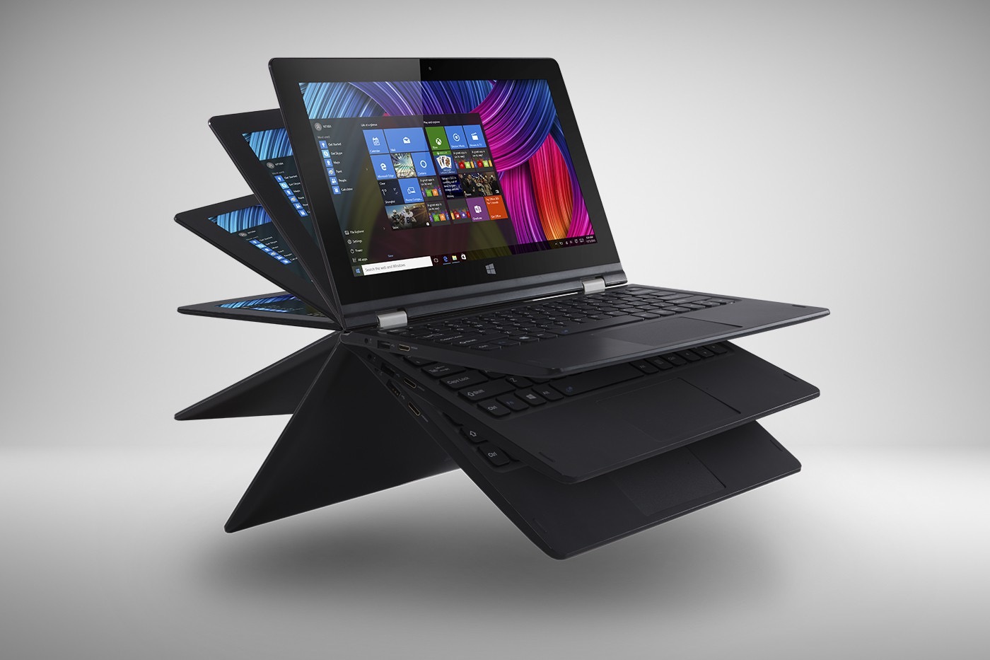 Czarny laptop konwertowalny w różnych konfiguracjach, prezentujący ekran z kolorowym motywem Windows, na jednolitym szarym tle.