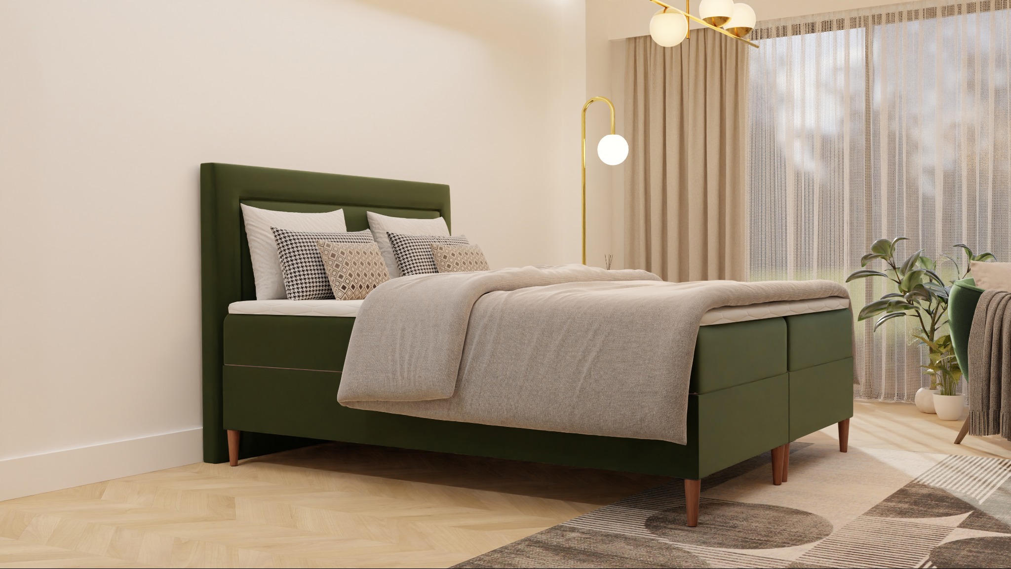 Łóżko kontynentalne z zielonym tapicerowanym wezgłowiem i beżową narzutą, ustawione na parkiecie w jasnym wnętrzu z zasłonami i lampą podłogową.